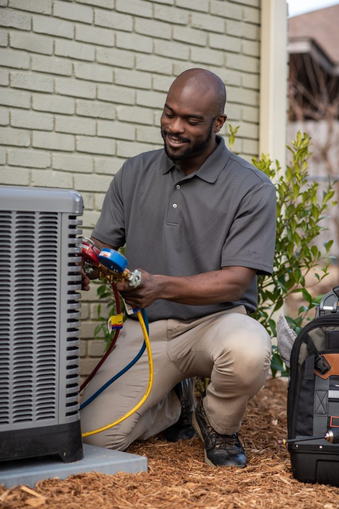 ruud certified contractor working on a ruud ac unit
