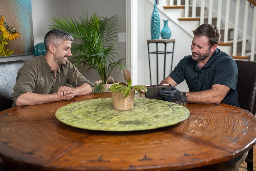 homeowner discussing a ruud system installation