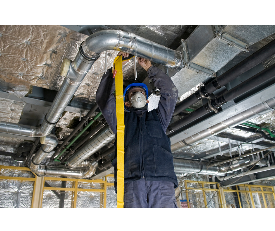 hvac tech repairing duct