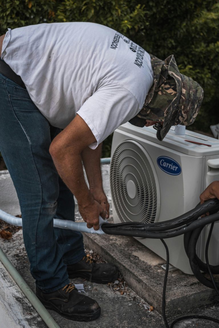 hvac contractor working on commercial unit